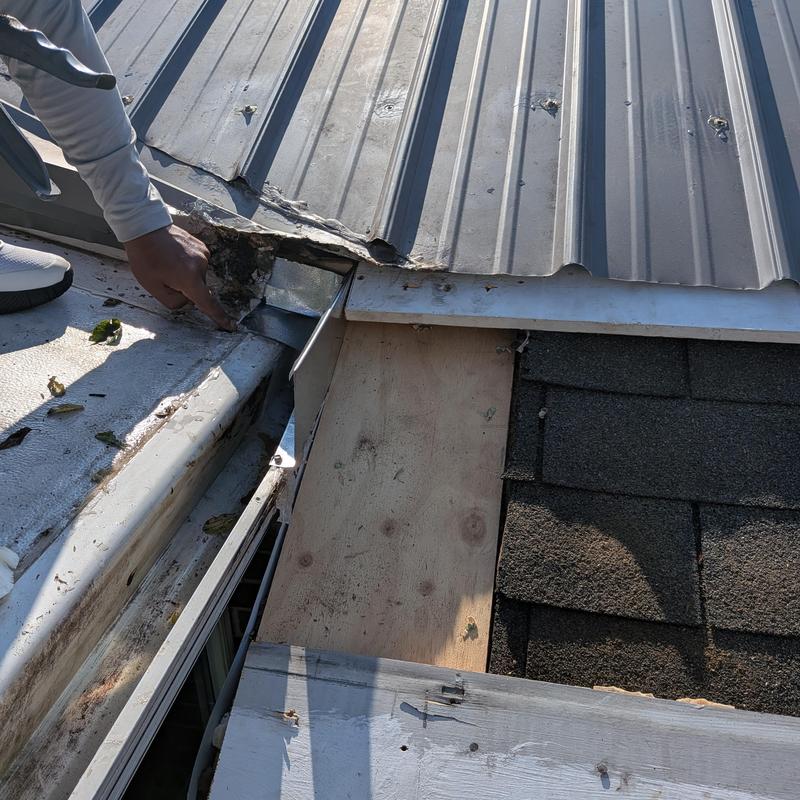 Sunroom metal roof edge with damaged flashing repair Sunroom metal roof edge with damaged flashing repair