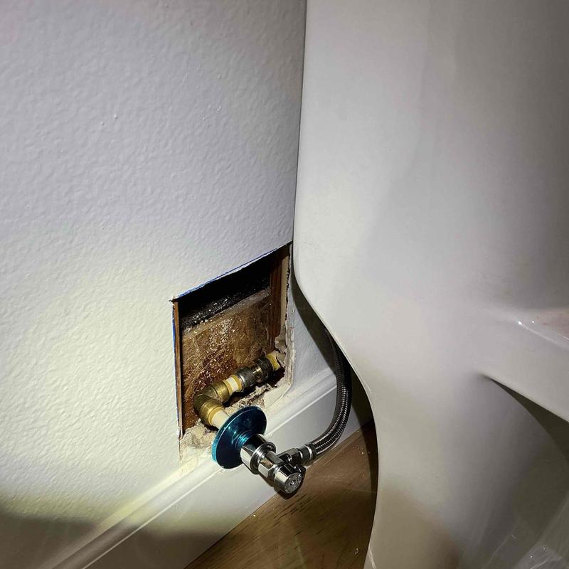 Angle stop valve with supply line by toilet base