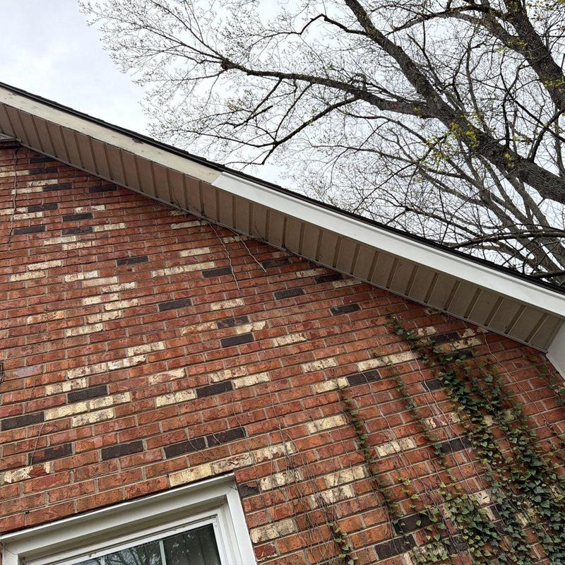 Soffit and fascia trim on brick house exterior