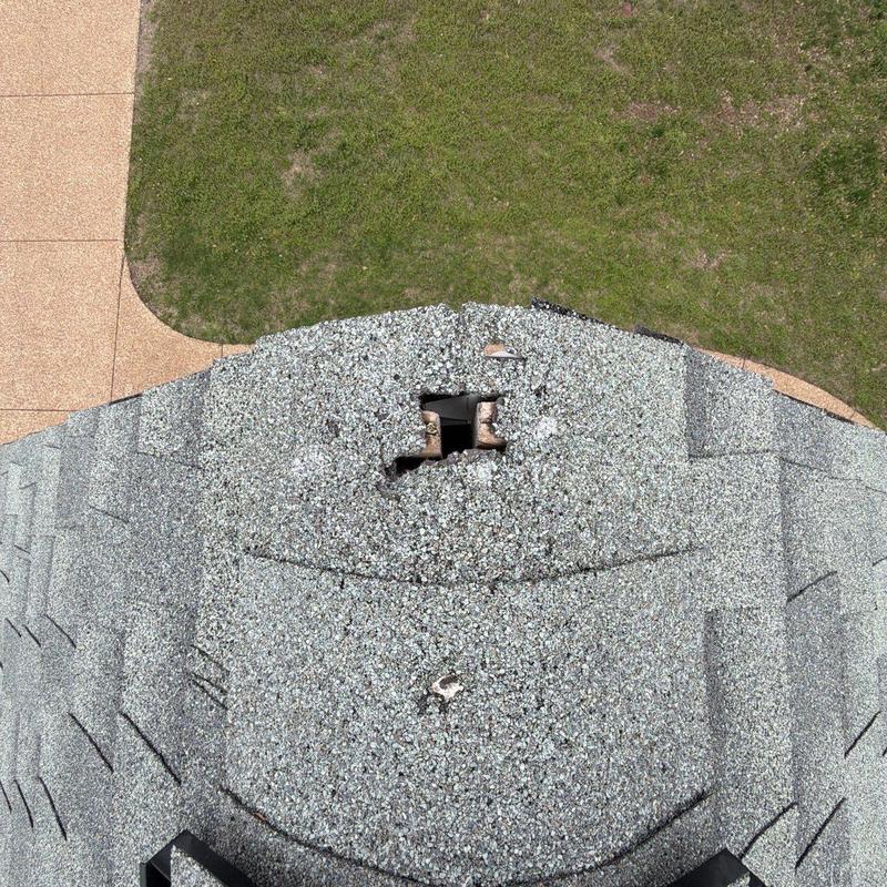 Roof shingles with hail damage and missing granules