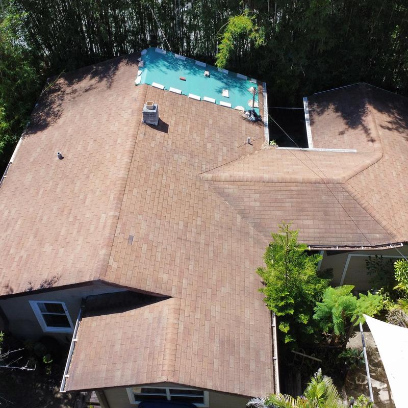 Shingle roof with tarp and chimney in Hudson, FL