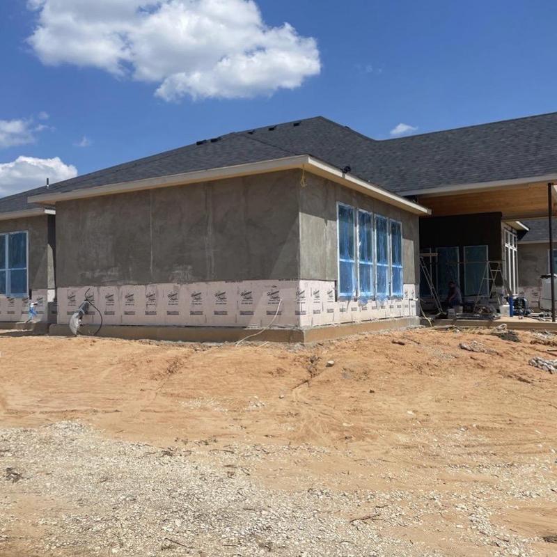 Metal lath installation on stucco house exterior