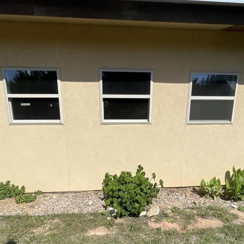 Stucco exterior wall with mesh base coat applied