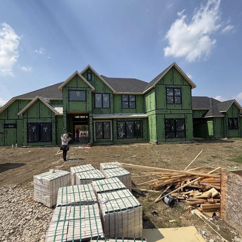 Brick bundles at new home construction site exterior Brick bundles at new home construction site exterior