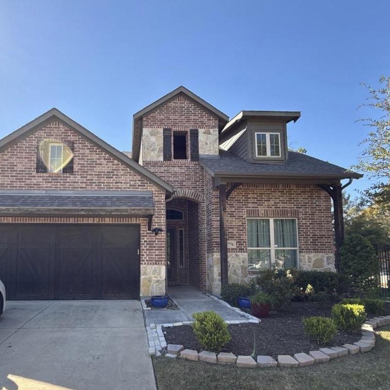 Brick exterior and stone accents on residential house Brick exterior and stone accents on residential house