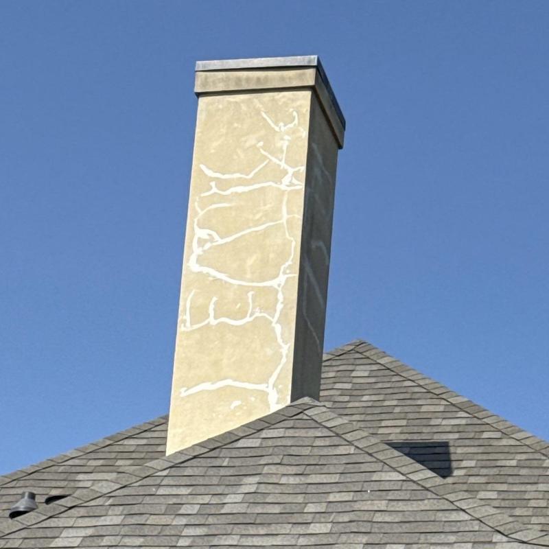 Chimney hairline cracks sealed with white sealant