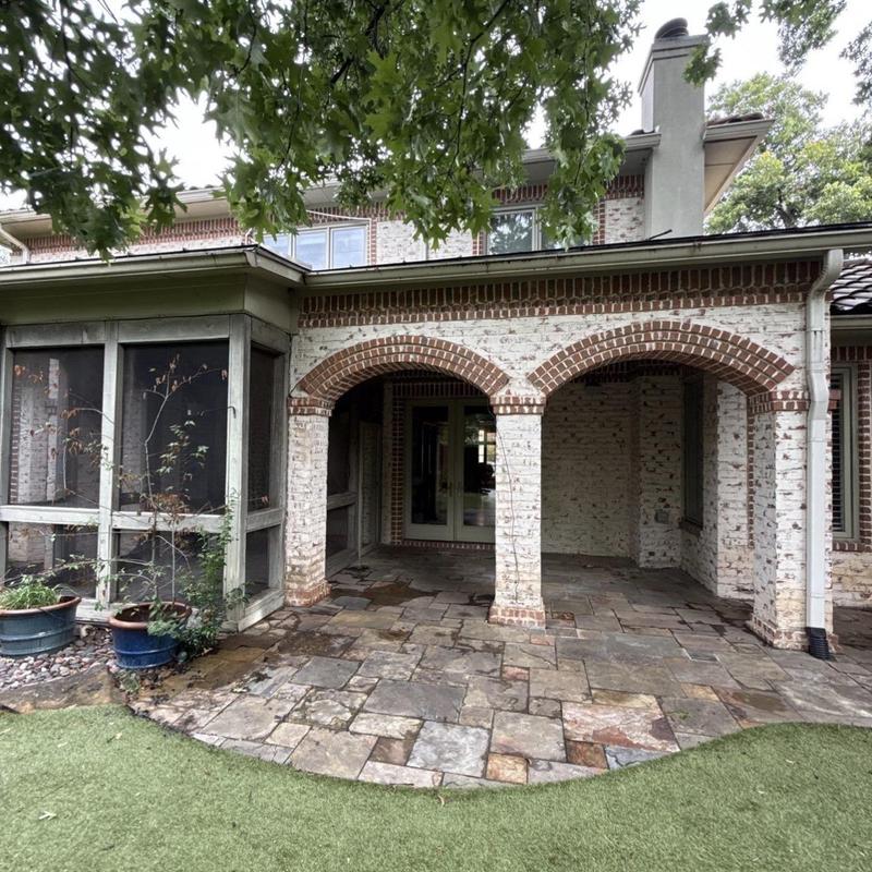 Brick arches and columns on house patio exterior Brick arches and columns on house patio exterior