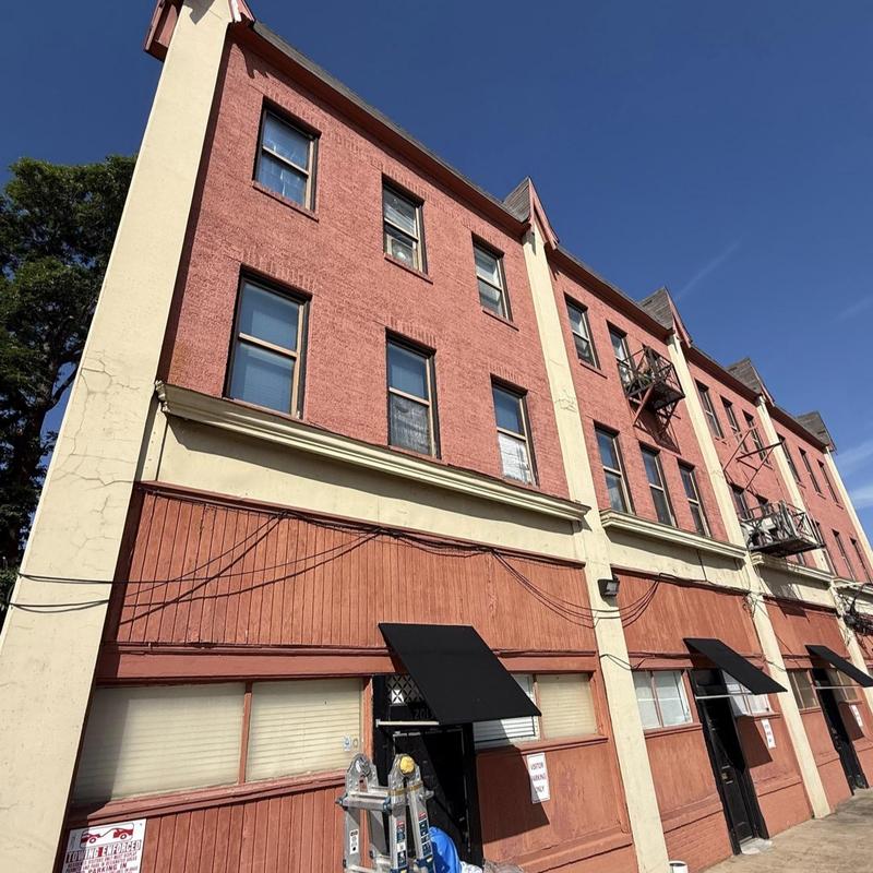 Stucco exterior cracks inspection on building facade