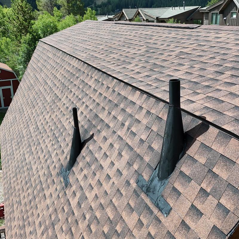 Asphalt shingle roof with custom pipe vent flashing