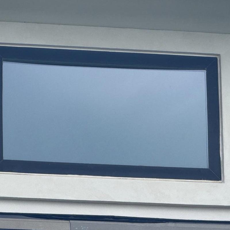 Stucco surrounding rectangular window frame in Fort Worth