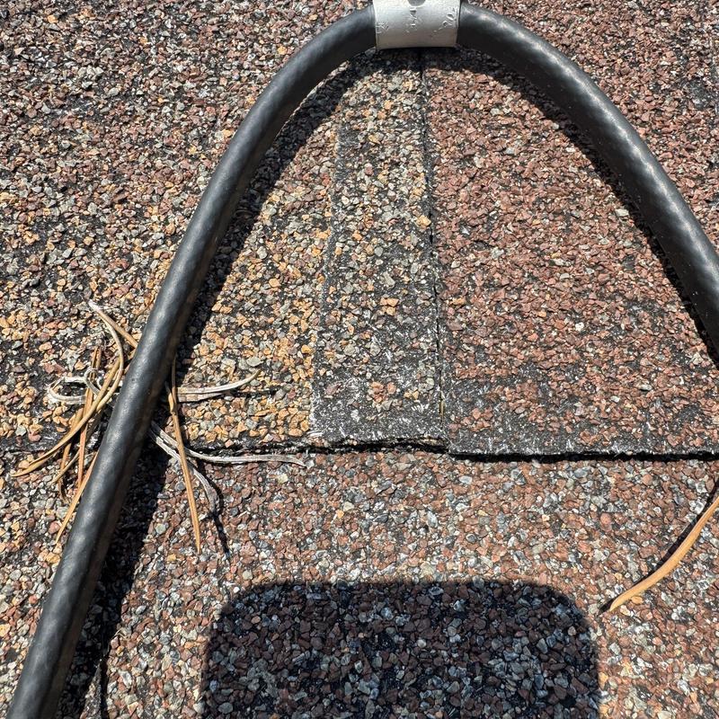 Heat tape cable on roof shingles during gutter demo Heat tape cable on roof shingles during gutter demo
