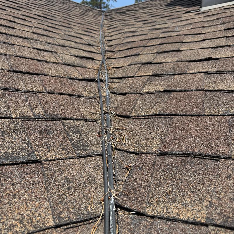 Heat tape on shingled roof with debris buildup Heat tape on shingled roof with debris buildup