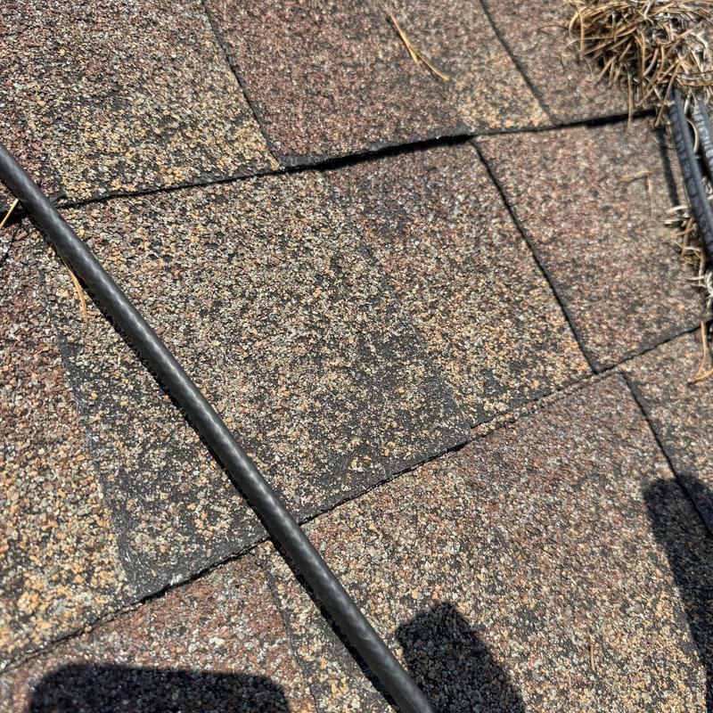 120v heat tape on roof shingles close-up 120v heat tape on roof shingles close-up