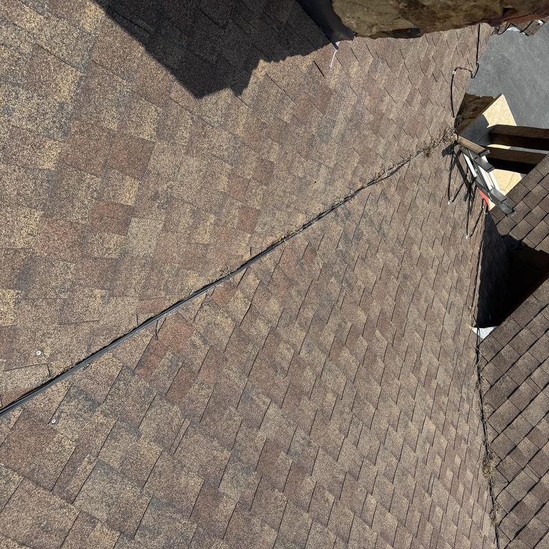 Heat tape cable installed on roof shingles Heat tape cable installed on roof shingles