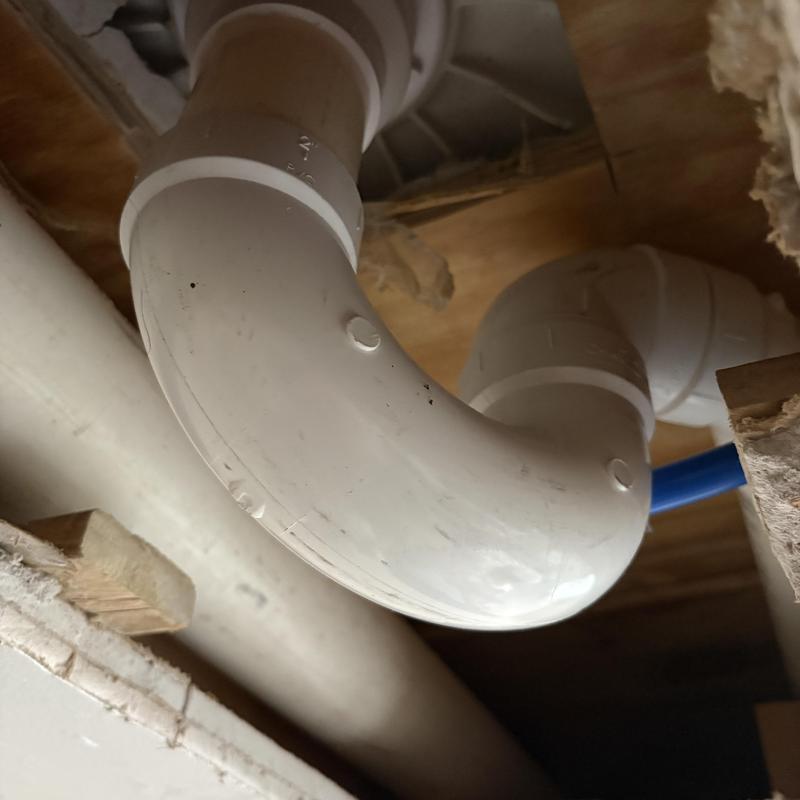 PVC shower drain and P-trap installation under floor PVC shower drain and P-trap installation under floor