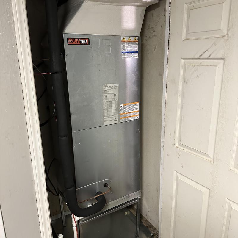 RunTru 4-ton air handler unit in residential closet RunTru 4-ton air handler unit in residential closet