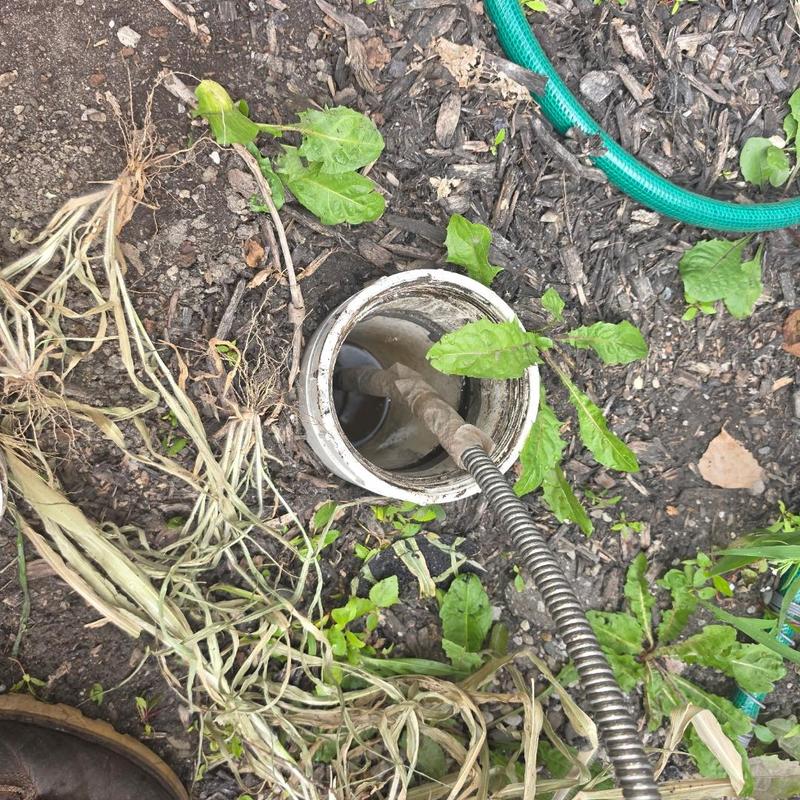 Main sewer cleanout with clog-clearing cable tool