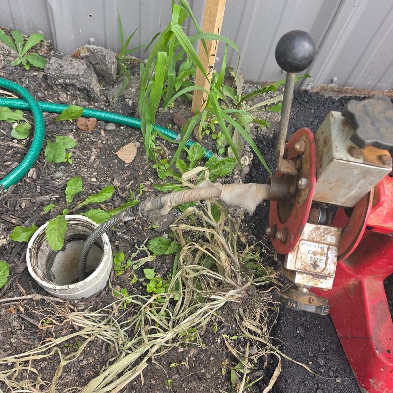 Main sewer line cleaning with mechanical snake