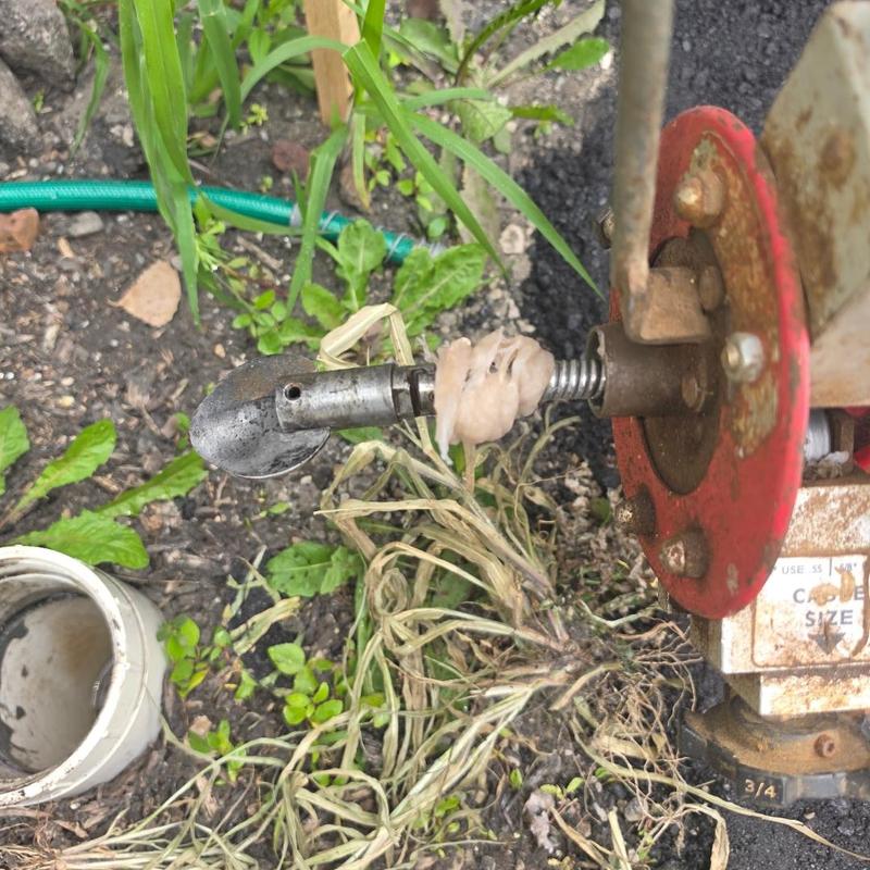 Main sewer line cabled near outside cleanout with blockage