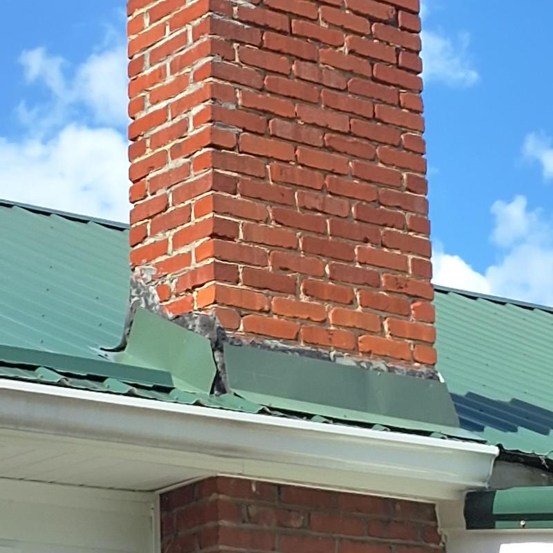 Chimney flashing and metal roof leak inspection