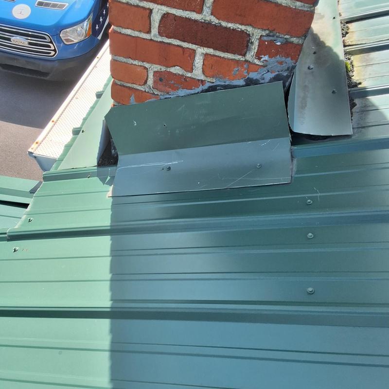 Chimney metal flashing with roof leak signs
