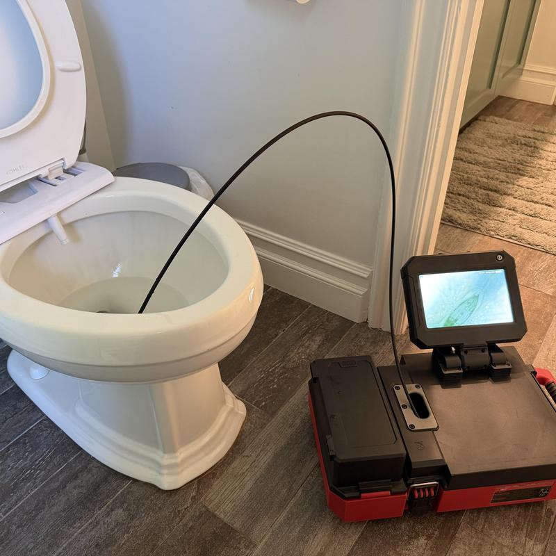 Toilet sewer line camera inspection for slow flush diagnosis