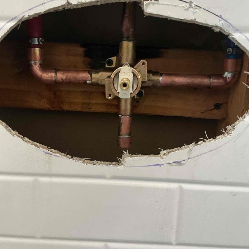 Moen shower valve and copper piping behind wall panel