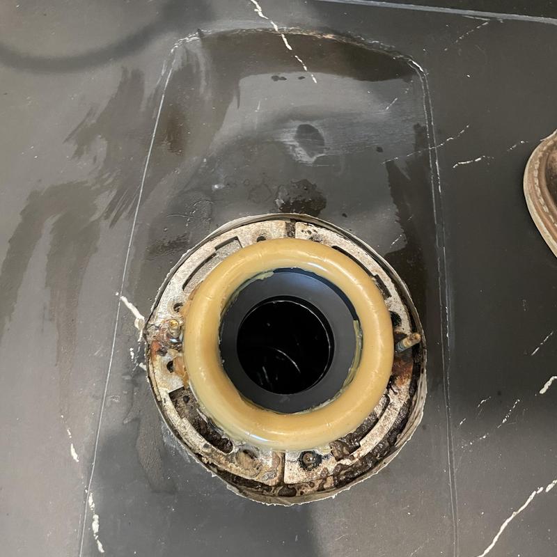 Toilet wax ring installation on flange in bathroom floor