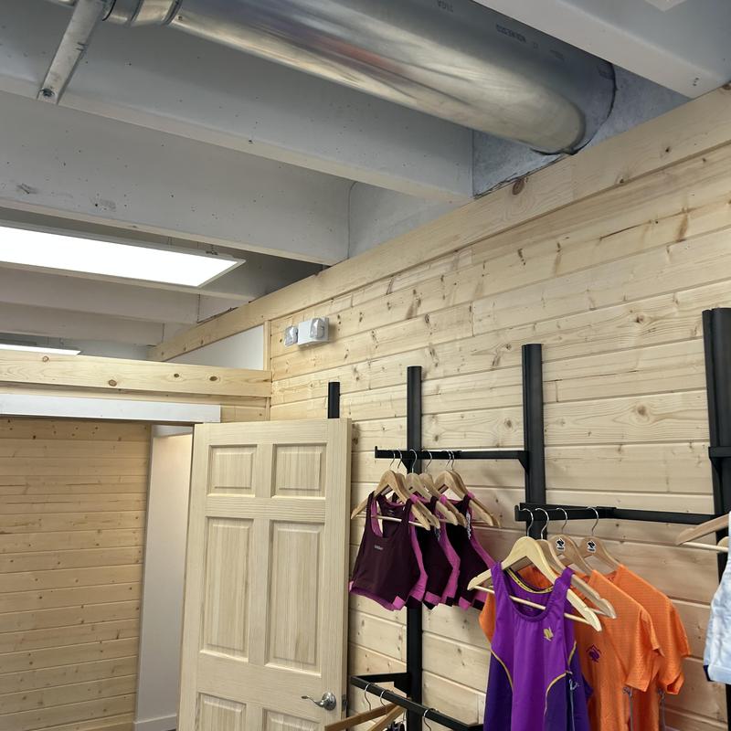 Lighting fixtures and exit signs installed in retail space Lighting fixtures and exit signs installed in retail space