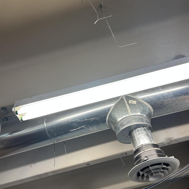 Fluorescent light fixture and HVAC duct diffuser installation Fluorescent light fixture and HVAC duct diffuser installation