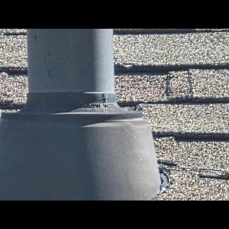Roof pipe boot with cracked seal on shingles Roof pipe boot with cracked seal on shingles