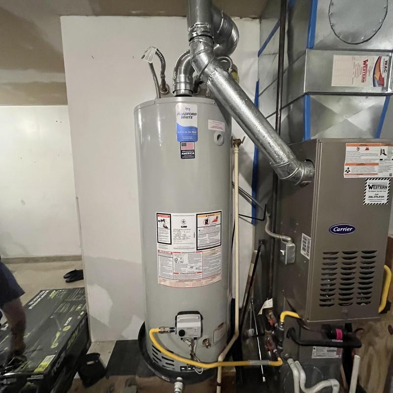 Water heater installation with venting and furnace nearby Water heater installation with venting and furnace nearby