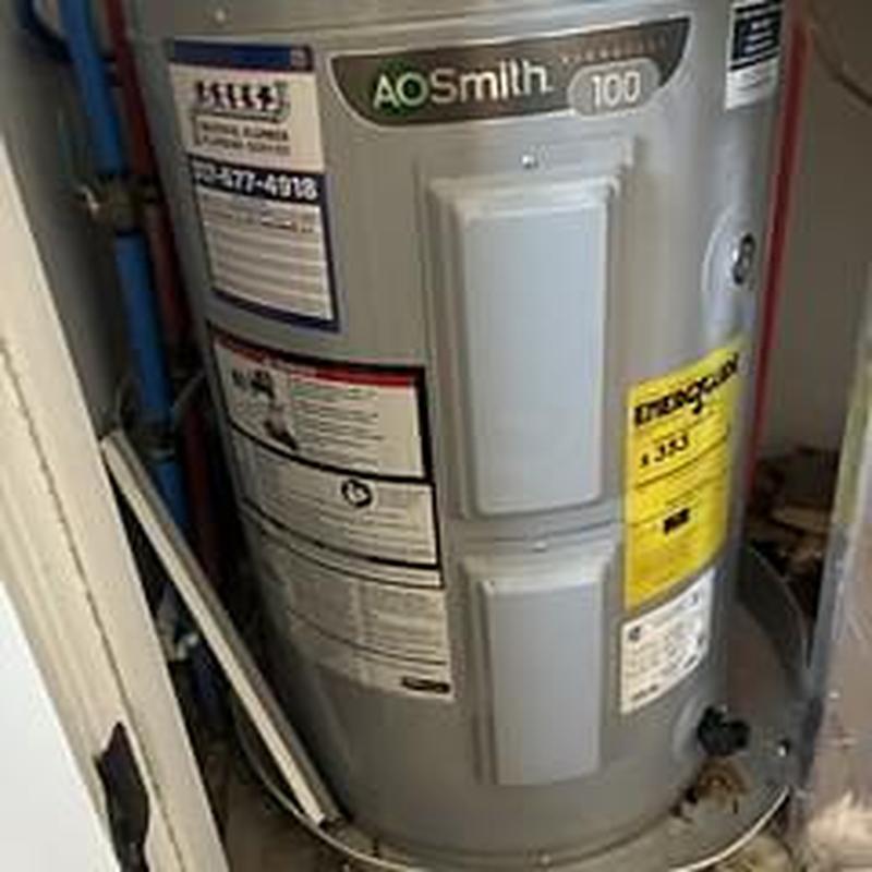 Electric water heater with replaced heating elements and thermostats Electric water heater with replaced heating elements and thermostats