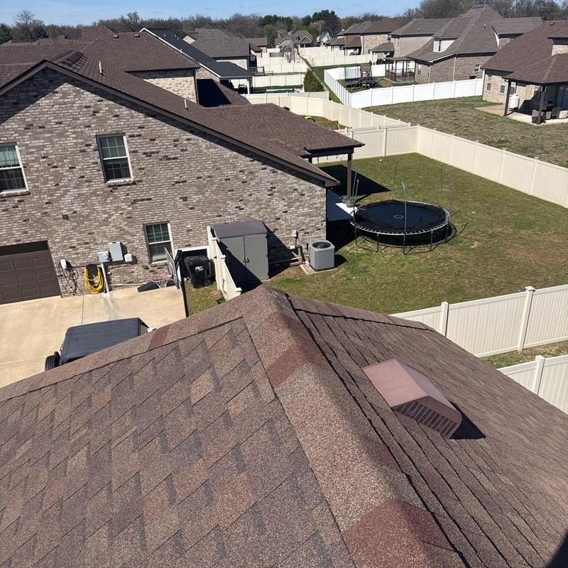Asphalt shingle roof with ridge vent in residential area