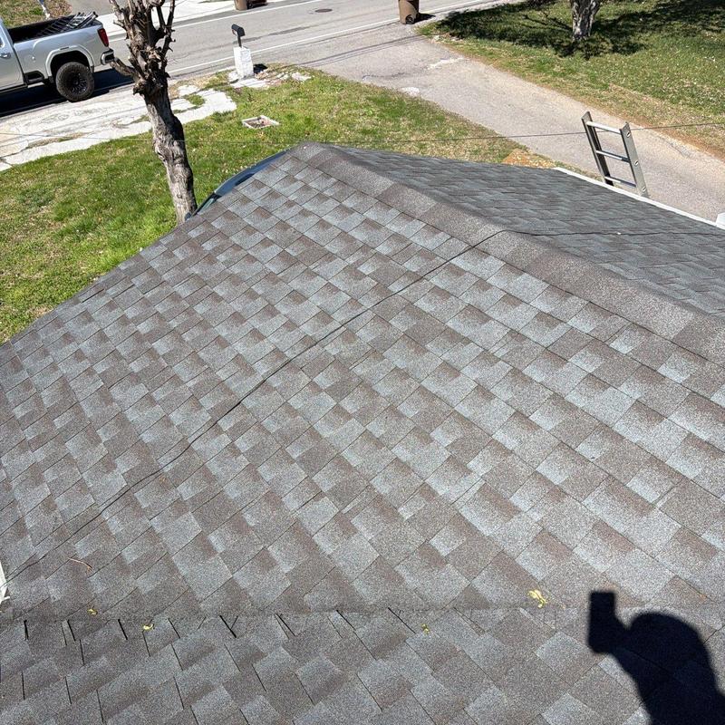 Asphalt shingle roof with hail damage inspection