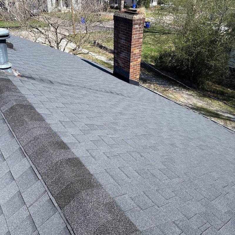 Asphalt shingle roof with chimney and flashing