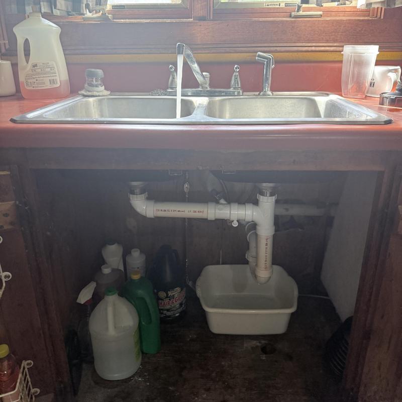 Kitchen sink drain plumbing with catch basin under counter Kitchen sink drain plumbing with catch basin under counter