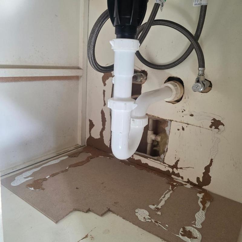 P-trap under vanity with plumbing connections