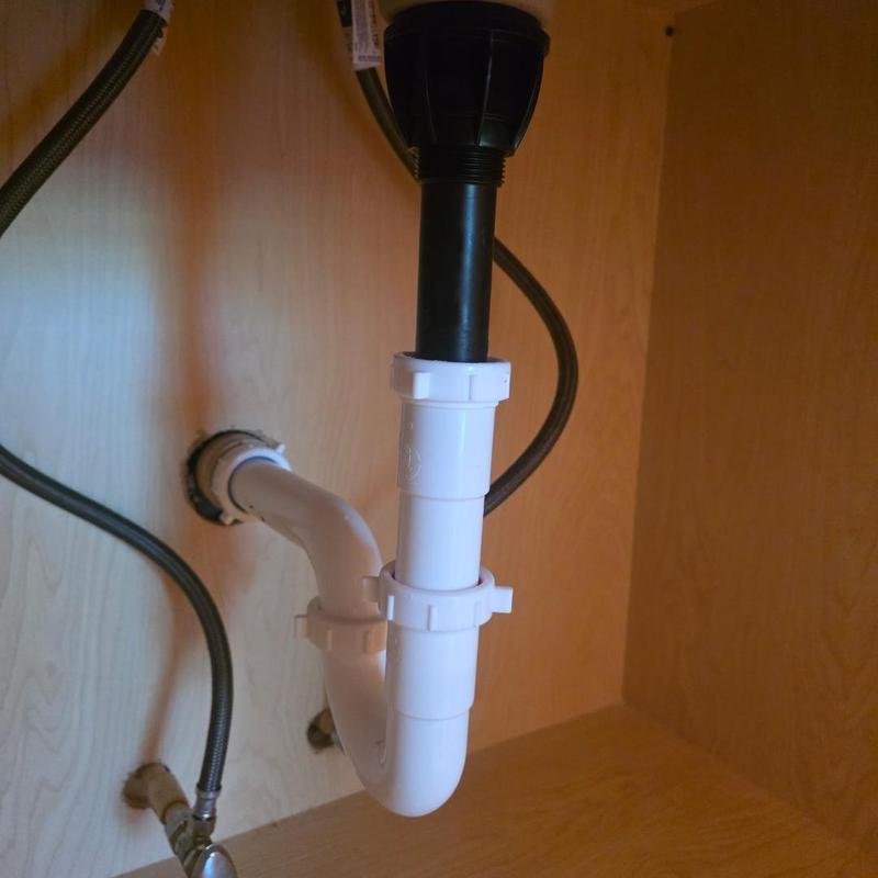 P trap plumbing installation under vanity cabinet