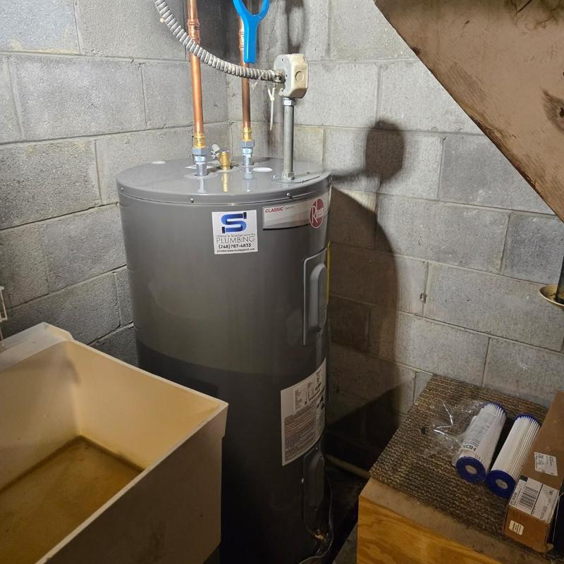 50-gallon water heater installation in basement corner