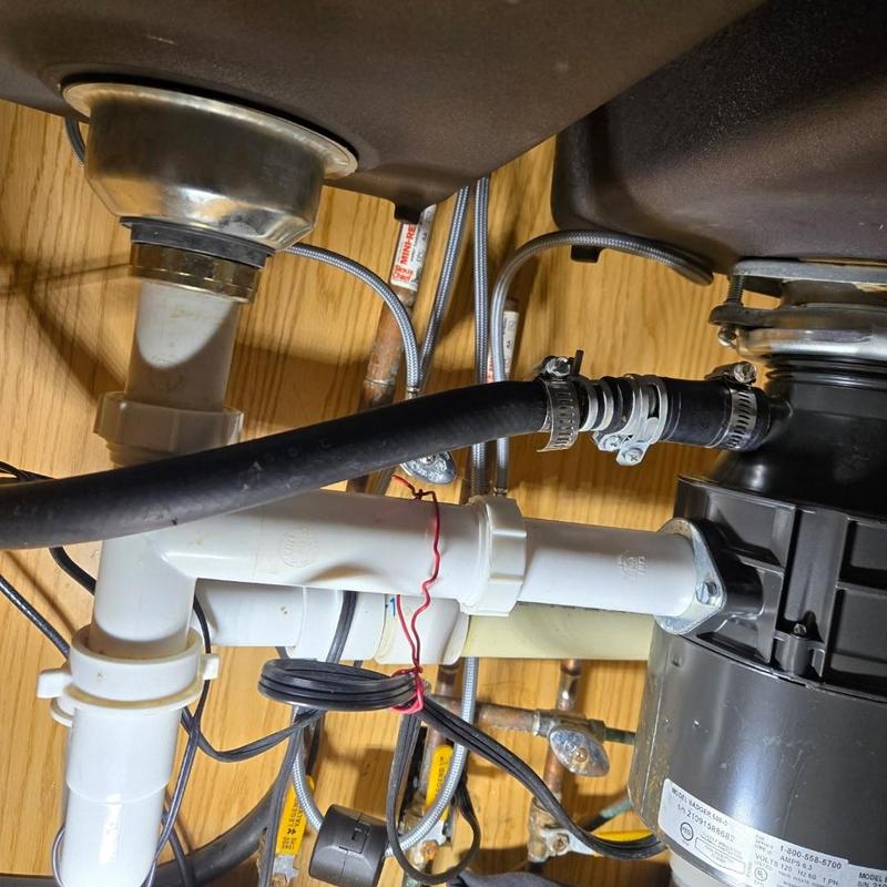 Kitchen sink drain pipes and garbage disposal installation