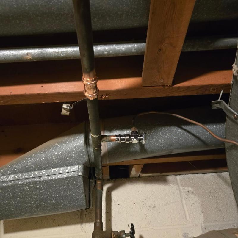 Gas line with ball valve and pipe repair in basement