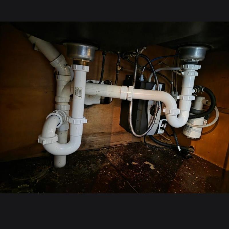 Kitchen sink drain pipes and garbage disposal installation