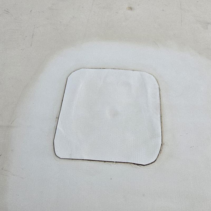 Flat roof patch with sealed edges on membrane