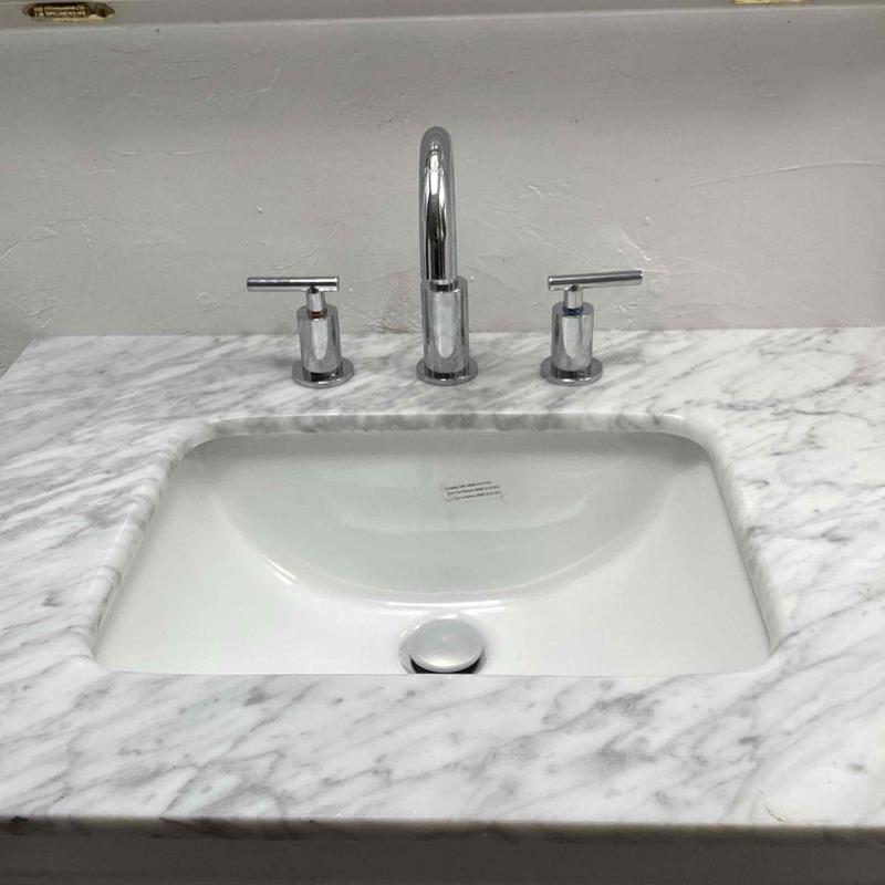 Bathroom faucet with marble countertop and sink