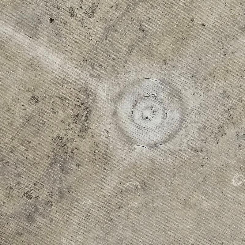 PVC flat roofing with visible cracks and exposed plate