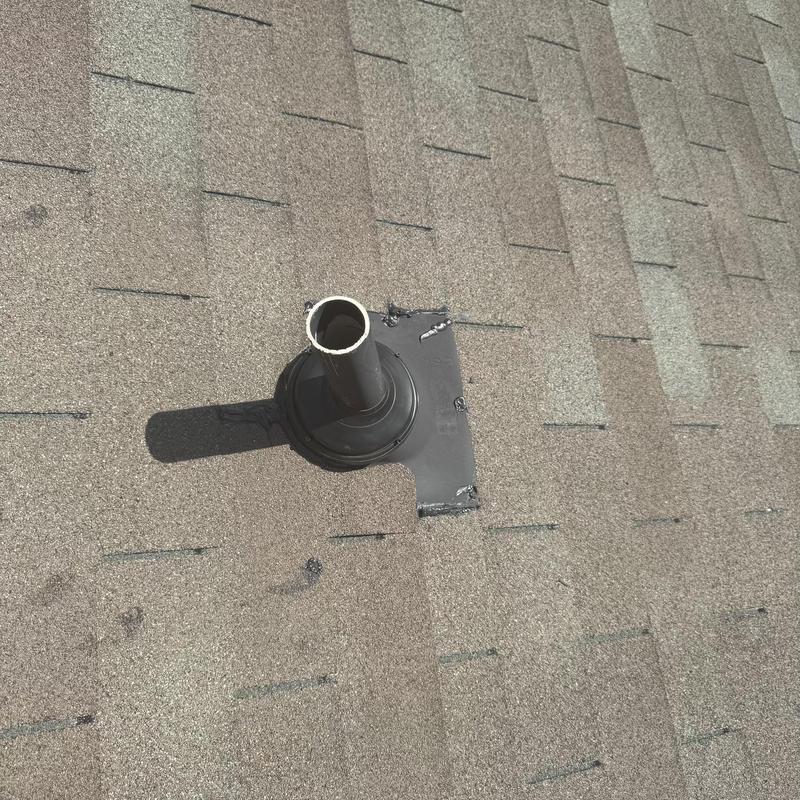 Pipe boot on three-tab shingle roof with new sealant Pipe boot on three-tab shingle roof with new sealant