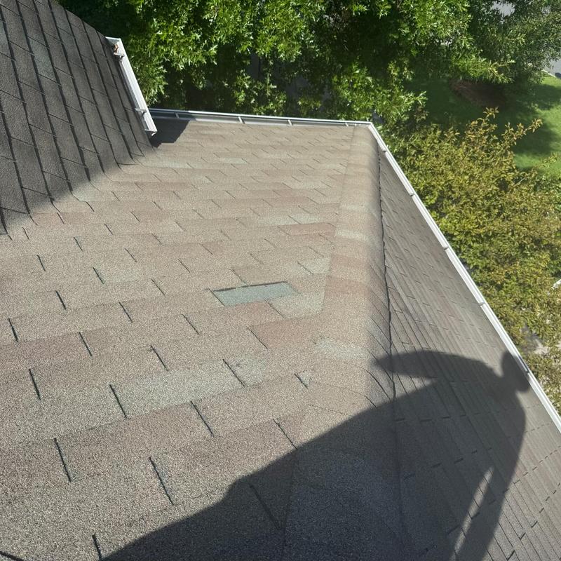 Three tab roof shingles with patch and pipe boot repair Three tab roof shingles with patch and pipe boot repair