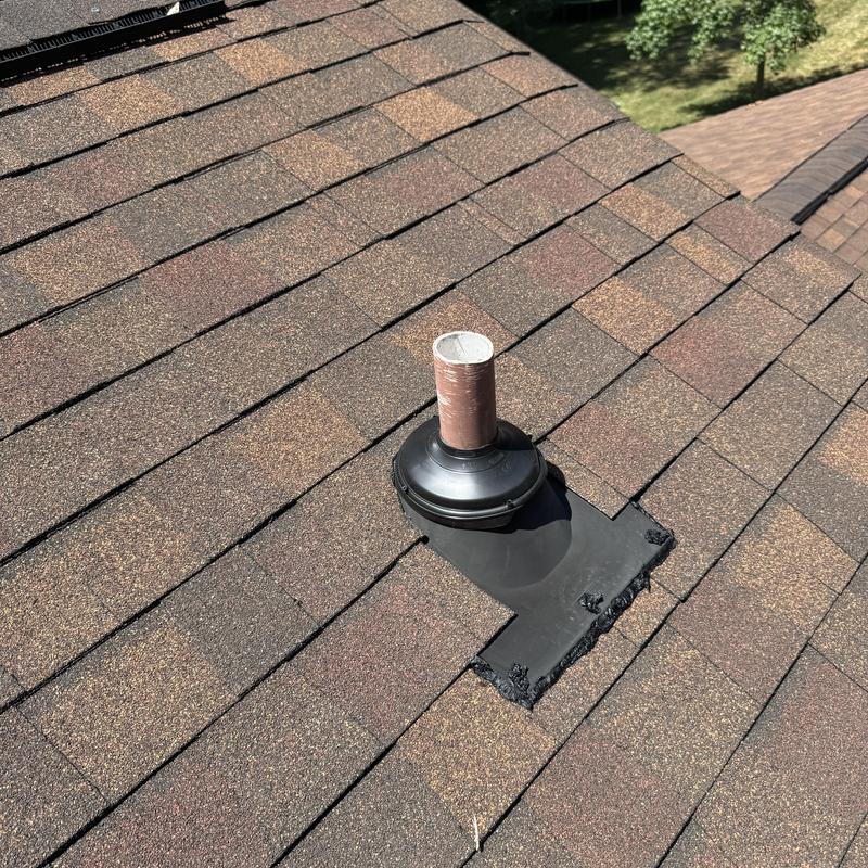 Pipe boot flashing on asphalt shingle roof installation Pipe boot flashing on asphalt shingle roof installation