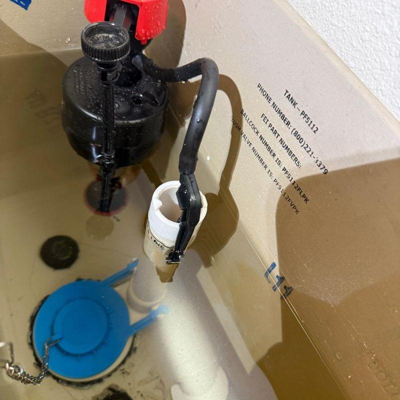 Toilet fill valve inside tank with repair parts
